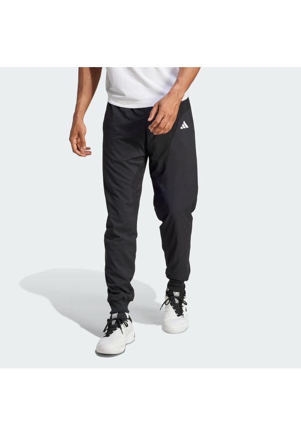 Adidas - Spodnie tenisowe Walk-On. Kolor: czarny. Sport: tenis