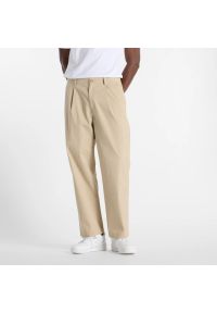 Spodnie męskie New Balance MP51563SOT – beżowe. Kolor: beżowy. Materiał: bawełna, materiał, nylon