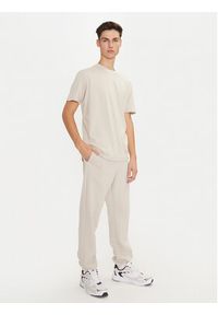 Champion Spodnie dresowe 220424 Écru Regular Fit. Materiał: syntetyk #5