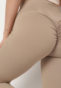 Born2be - Beżowe Legginsy Typu Dzwony z Wysokim Stanem Orralise. Stan: podwyższony. Kolor: beżowy. Materiał: tkanina. Styl: klasyczny
