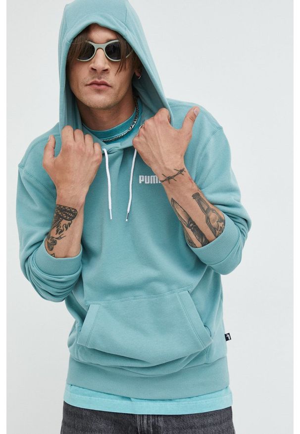 Puma bluza męska kolor turkusowy z kapturem z aplikacją. Typ kołnierza: kaptur. Kolor: turkusowy. Materiał: materiał. Wzór: aplikacja