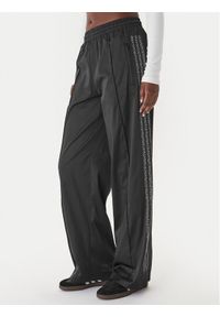 Adidas - adidas Spodnie dresowe Pearl Firebird KC7863 Czarny Loose Fit. Kolor: czarny. Materiał: syntetyk #1
