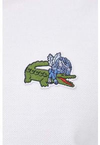 Lacoste polo bawełniane x Netflix kolor biały z aplikacją. Typ kołnierza: polo. Kolor: biały. Materiał: bawełna. Długość: krótkie. Wzór: aplikacja #2