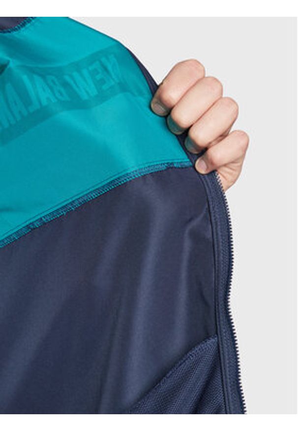 New Balance Wiatrówka MJ23900 Granatowy Relaxed Fit. Kolor: niebieski. Materiał: syntetyk