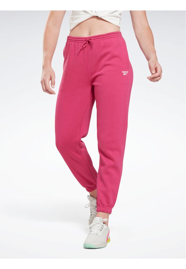 Reebok Spodnie dresowe Identity H54768 Różowy Regular Fit. Kolor: różowy. Materiał: bawełna, dresówka