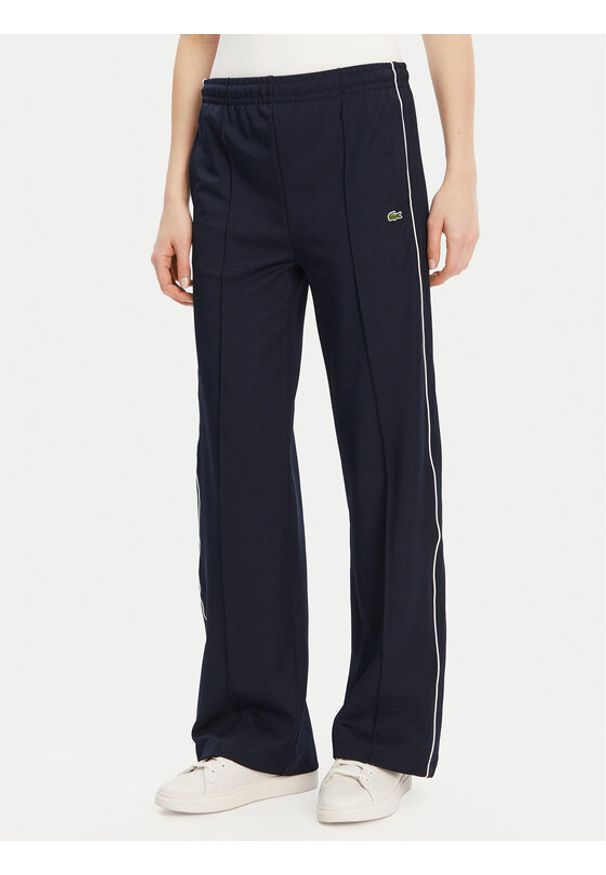 Lacoste Spodnie dresowe XF7260 Granatowy Relaxed Fit. Kolor: niebieski. Materiał: syntetyk, bawełna
