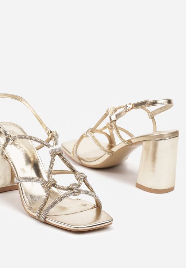 Renee - Złote Sandały na Obcasie z Cyrkoniami Zapinane Wokół Kostki Chrisstana. Kolor: złoty. Materiał: jeans. Obcas: na obcasie. Styl: elegancki. Wysokość obcasa: średni