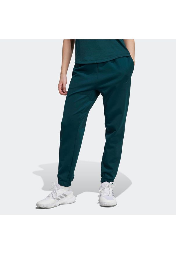 Adidas - Spodnie fitness damskie ADIDAS. Kolor: zielony. Materiał: materiał. Sport: fitness