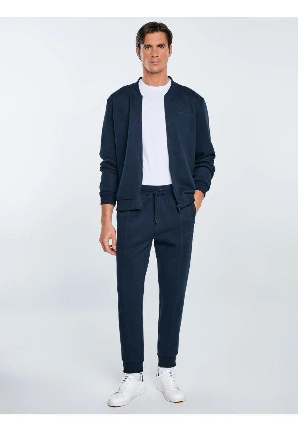 Big-Star - Spodnie męskie dresowe granatowe Wladorp 403. Kolor: niebieski. Materiał: dresówka. Wzór: nadruk, ze splotem