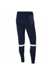 Nike - Męskie Spodnie Do Biegania Strike 21 Fleece. Kolor: niebieski. Materiał: dresówka