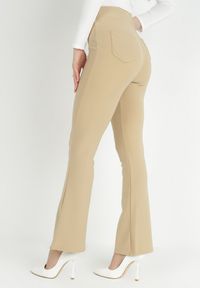 Born2be - Beżowe Spodnie Dzwony Kostemus. Kolor: beżowy. Materiał: dzianina. Wzór: gładki. Styl: elegancki