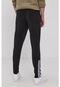 Adidas - adidas Spodnie GS1582 męskie kolor czarny z nadrukiem. Kolor: czarny. Materiał: bawełna, poliester. Wzór: nadruk #3
