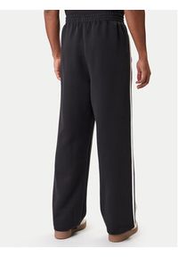 Adidas - adidas Spodnie dresowe adicolor Spacer Track JX1506 Czarny Baggy Fit. Kolor: czarny. Materiał: bawełna. Sport: turystyka piesza #2