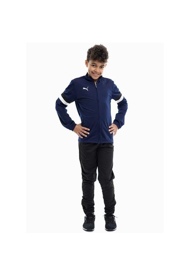 Dres dla dzieci Puma Team Rise. Okazja: na uczelnię. Kolor: wielokolorowy, niebieski, biały, czarny. Materiał: dresówka. Styl: sportowy