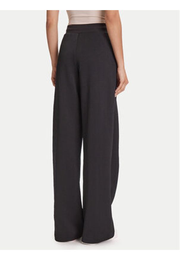 Guess Spodnie dresowe V5YB19 KBSL2 Czarny Regular Fit. Kolor: czarny. Materiał: syntetyk