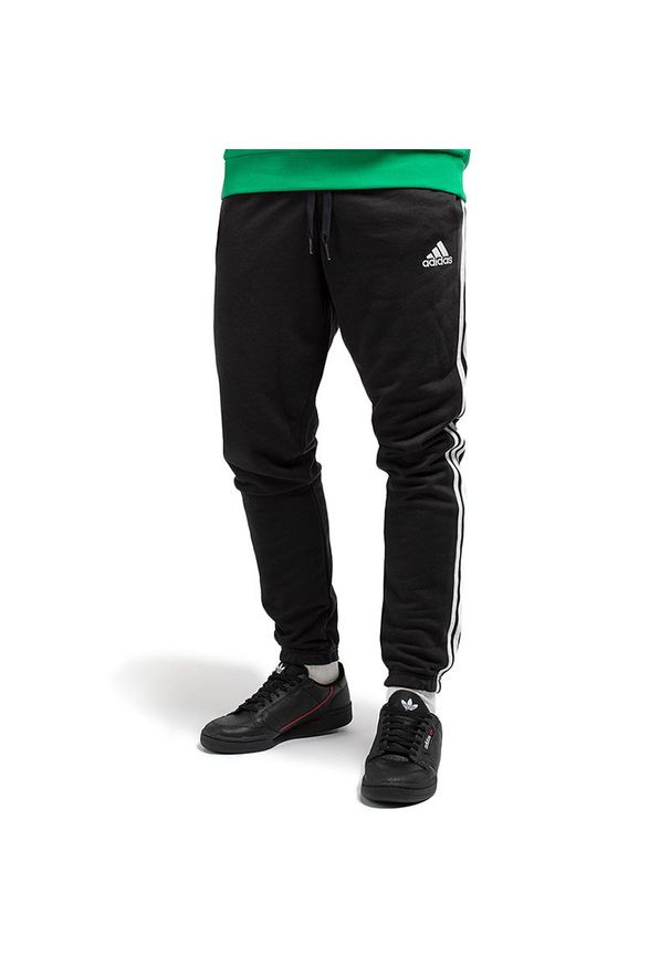 Adidas - Spodnie dresowe adidas Essentials French Terry Tapered 3-Stripes GK8829 - czarne. Kolor: czarny. Materiał: dresówka. Wzór: paski