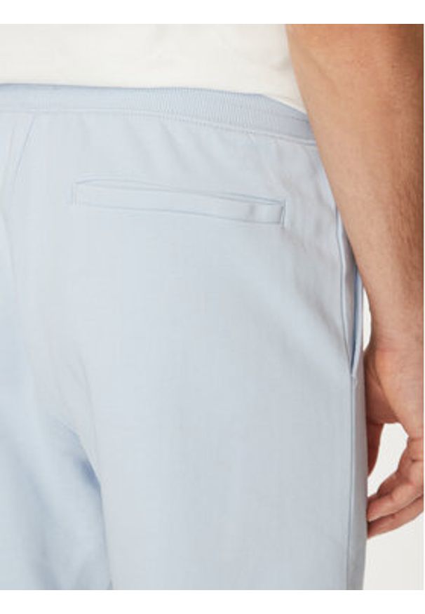 TOMMY HILFIGER - Tommy Hilfiger Szorty materiałowe Essential Terry Sweatshort MW0MW37240 Błękitny Regular Fit. Kolor: niebieski. Materiał: bawełna
