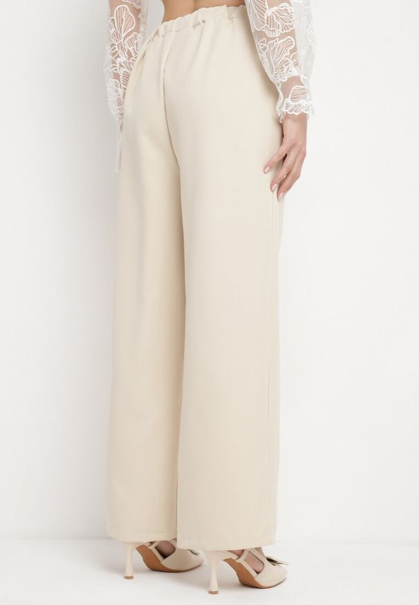 Born2be - Jasnobeżowe Eleganckie Spodnie z Szerokimi Nogawkami Kahinuni. Kolor: beżowy. Materiał: tkanina. Wzór: gładki. Styl: elegancki