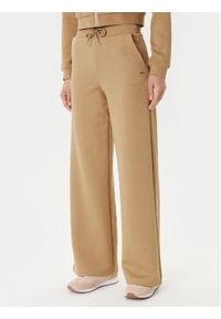 Guess Spodnie dresowe V5YB19 KBSL2 Beżowy Regular Fit. Kolor: beżowy. Materiał: syntetyk