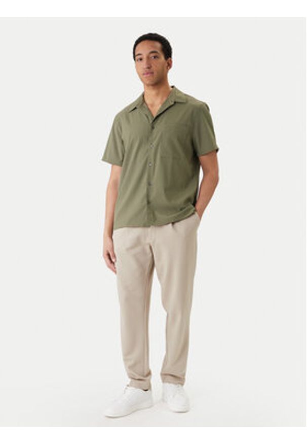 Calvin Klein Spodnie materiałowe LV04LF607G Beżowy Tapered Fit. Kolor: beżowy. Materiał: wiskoza