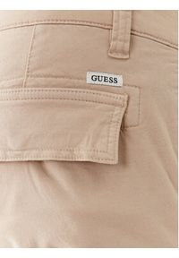 Guess Spodnie materiałowe M2GB27 WCNZ0 Beżowy Slim Fit. Kolor: beżowy. Materiał: materiał, bawełna