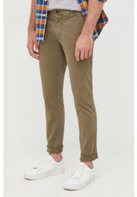 TOMMY HILFIGER - Tommy Hilfiger spodnie męskie kolor zielony dopasowane. Kolor: zielony. Materiał: bawełna #1