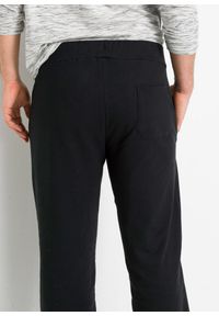 bonprix - Spodnie joggingowe ze sportowymi detalami, z czystej bawełny organicznej. Kolor: czarny. Materiał: bawełna. Wzór: nadruk. Styl: sportowy #3