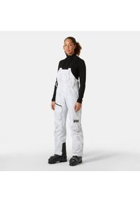 Damskie spodnie narciarskie na szelkach Helly Hansen Powderqueen. Kolor: szary. Sezon: zima. Sport: narciarstwo #1