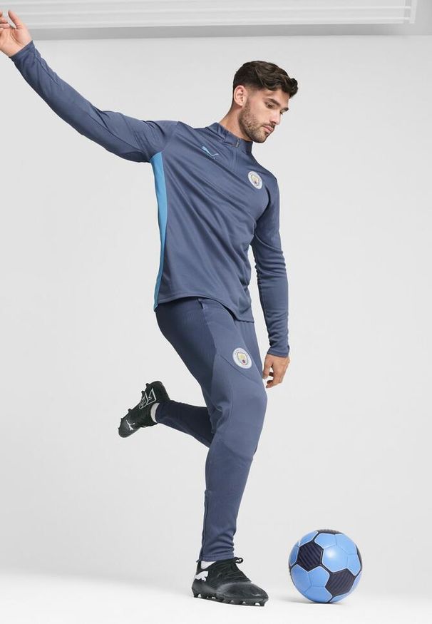 Puma - Męskie spodnie treningowe Manchester City PUMA Inky Blue Magic. Kolor: niebieski