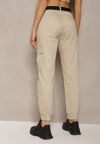 Renee - Beżowe Spodnie High Waist z Bawełny o Kroju Bojówek z Gumką na Nogawkach i PaskiemCitia. Stan: podwyższony. Kolor: beżowy. Materiał: bawełna. Styl: elegancki
