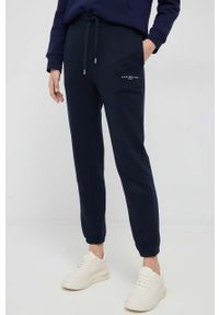 TOMMY HILFIGER - Tommy Hilfiger spodnie dresowe kolor granatowy gładkie. Kolor: niebieski. Materiał: dresówka. Wzór: gładki #1