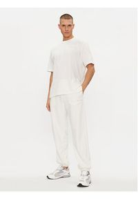 Champion Spodnie dresowe E20001 Biały Regular Fit. Kolor: biały. Materiał: bawełna #3