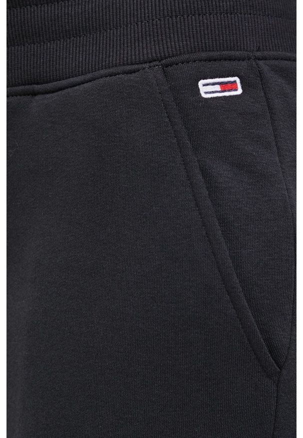 Tommy Jeans Spodnie damskie kolor czarny gładkie. Kolor: czarny. Materiał: dzianina. Wzór: gładki