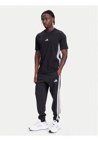 Adidas - adidas Spodnie dresowe Essentials 3-Stripes JD1861 Czarny Regular Fit. Kolor: czarny. Materiał: bawełna #4