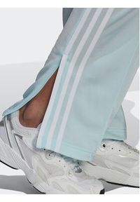Adidas - adidas Spodnie dresowe adicolor Classics Firebird Primeblue HN5897 Błękitny Regular Fit. Kolor: niebieski. Materiał: syntetyk
