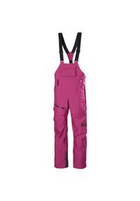 Damskie spodnie narciarskie na szelkach Helly Hansen Powderqueen. Kolor: różowy. Sezon: zima. Sport: narciarstwo #1
