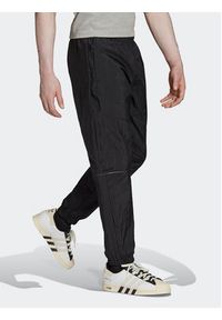Adidas - adidas Spodnie dresowe Reveal Material Mix HK2732 Czarny Regular Fit. Kolor: czarny. Materiał: dresówka, syntetyk #6