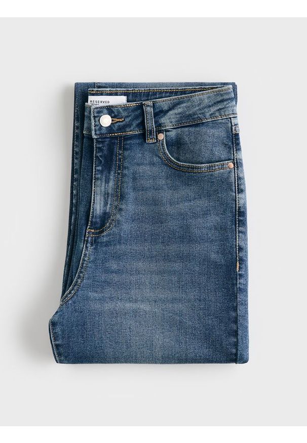 Reserved - Jeansy flare - niebieski. Kolor: niebieski