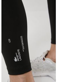 Lacoste legginsy damskie kolor czarny z nadrukiem. Kolor: czarny. Materiał: poliester. Wzór: nadruk