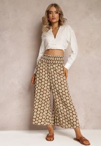 Renee - Jasnobrązowe Szerokie Spodnie z Wiskozy w Kwiaty Ramit. Stan: podwyższony. Kolor: brązowy. Materiał: wiskoza. Wzór: kwiaty. Styl: elegancki