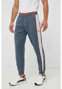 Puma spodnie dresowe męskie wzorzyste. Kolor: szary. Materiał: dresówka #1