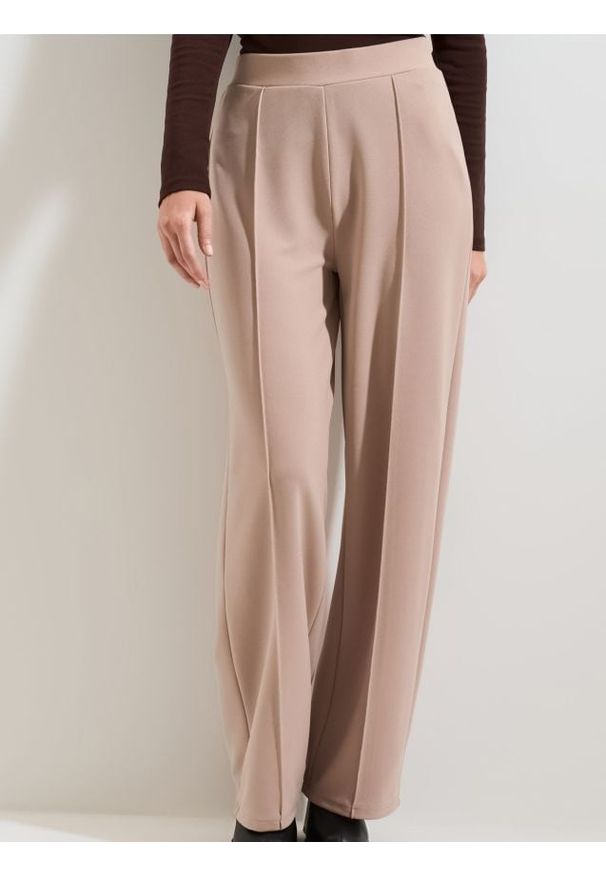 Sinsay - Spodnie wide leg - beżowy. Kolor: beżowy