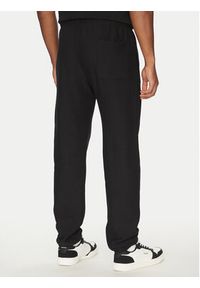 Champion Spodnie dresowe 221620 Czarny Regular Fit. Kolor: czarny. Materiał: bawełna