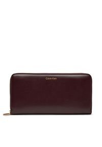 Calvin Klein Duży Portfel Damski Ck Large Zip Around LV04F1093G Bordowy. Kolor: czerwony. Materiał: skóra