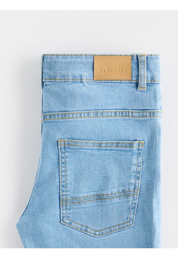 Reserved - Jeansy slim - niebieski. Kolor: niebieski