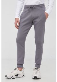 Calvin Klein Jeans Spodnie J30J319652.PPYY męskie kolor szary z nadrukiem. Kolor: szary. Materiał: włókno, dzianina. Wzór: nadruk #1