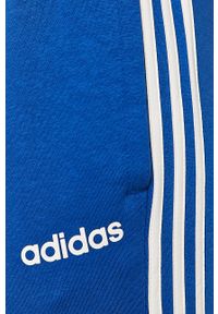 Adidas - adidas - Spodnie. Kolor: niebieski. Materiał: bawełna, poliester, dzianina. Wzór: nadruk, aplikacja #2