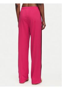 Adidas - adidas Spodnie dresowe Firebird Loose Tracksuit KW0228 Różowy Loose Fit. Kolor: różowy. Materiał: syntetyk #3