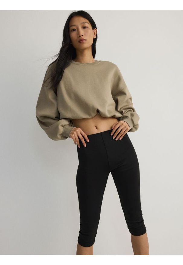 Reserved - Legginsy - czarny. Kolor: czarny. Materiał: tkanina. Wzór: gładki