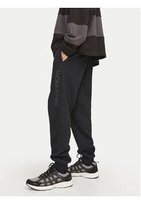 Jack & Jones Spodnie dresowe Gordon 12258477 Czarny Regular Fit. Kolor: czarny. Materiał: syntetyk, bawełna